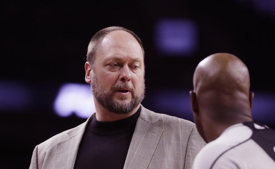 FILE - Brooklyn Nets assistant coach Joe Wolf speaks with a referee during the second half of an NBA basketball game against the Detroit Pistons, Saturday, Jan. 9, 2016, in Auburn Hills, Michigan. Joe Wolf, a former North Carolina captain who went on to play for seven teams in his 11-year NBA career and then became a coach, died unexpectedly on Thursday, the Milwaukee Bucks announced. (AP Photo/Carlos Osorio, File)