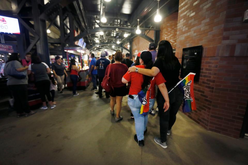 El Paso Chihuahuas fans Cindy Montoya and Liz Flores, right, wear their Pride flags in their back pockets as they walk through the stadium during Pride Night at the Chihuahuas game against the New Orleans Baby Cakes on June 13, 2019, at Southwest University Park in El Paso.
This year, Pride Night will be June 22.