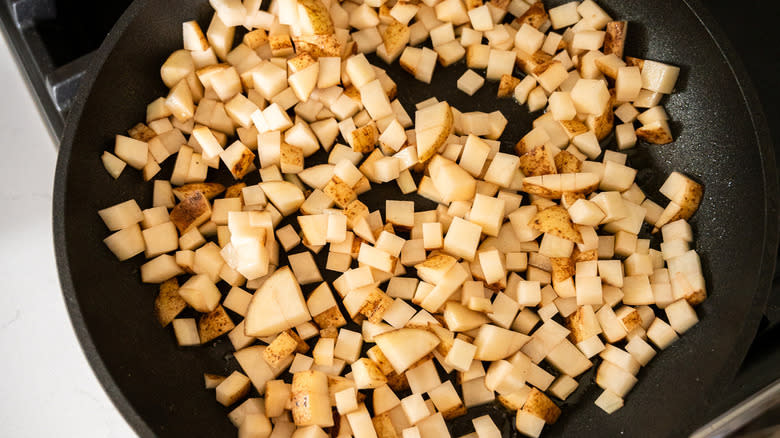 cubed potatoes in pan
