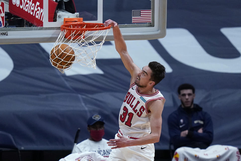 Chicago Bulls guard Tomas Satoransky dunks during the first half of the team's NBA basketball game against the New Orleans Pelicans in New Orleans, Wednesday, March 3, 2021. (AP Photo/Gerald Herbert)