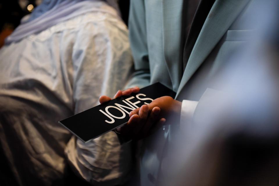 Justin Jones holds his nameplate as he arrives at the Tennessee State Capitol after the Nashville's Metro Council reappointed him to the House of Representatives on Monday, April 10, 2023, after his expulsion last week.