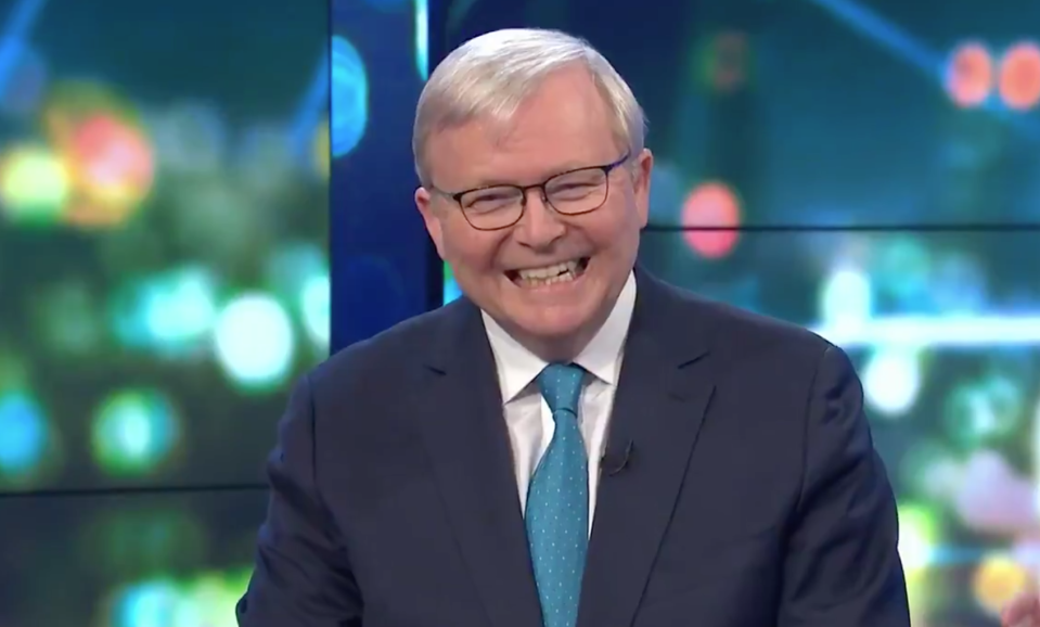 A close up of Mr Rudd in a blue tie laughing.