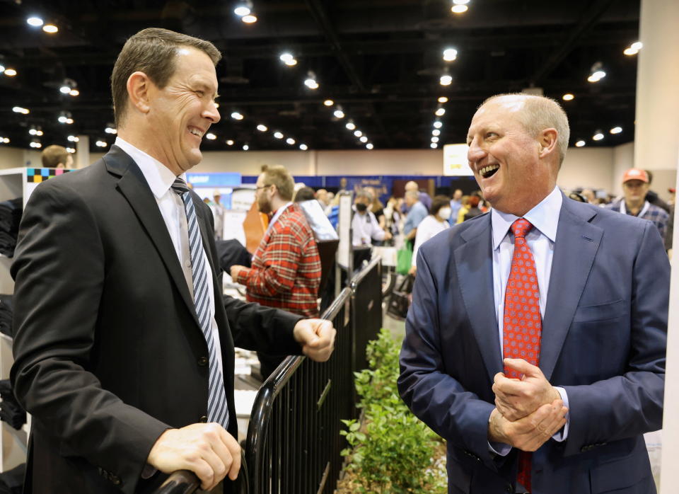 Pat Egan, CEO of See's Candies, talks to Gregory Abel, the CEO of Berkshire Hathaway Energy and who is designated to succeed Warren Buffett as Berkshire CEO, during the first in-person annual meeting since 2019 of Berkshire Hathaway Inc in Omaha, Nebraska, U.S. April 29, 2022.  REUTERS/Scott Morgan