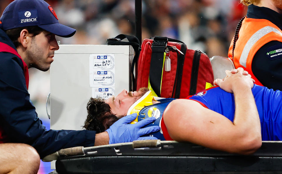 Angus Brayshaw, pictured here being taken off the field on a medicab in Melbourne's clash with Collingwood.