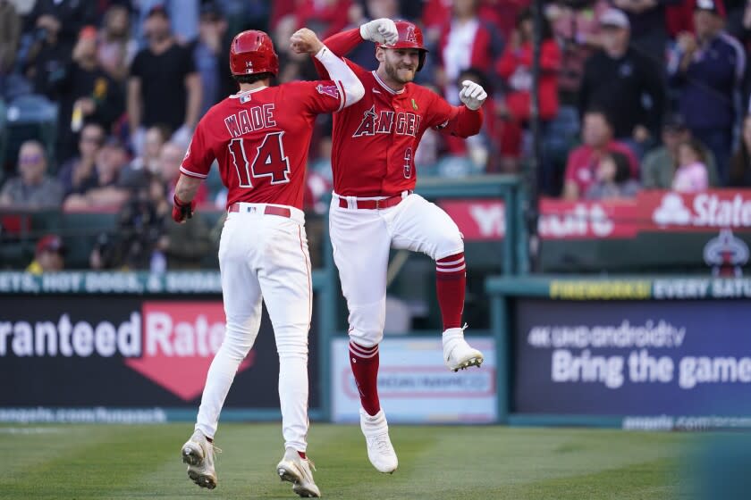 Los Angeles Angels' Taylor Ward (3) celebrates with Tyler Wade (14)