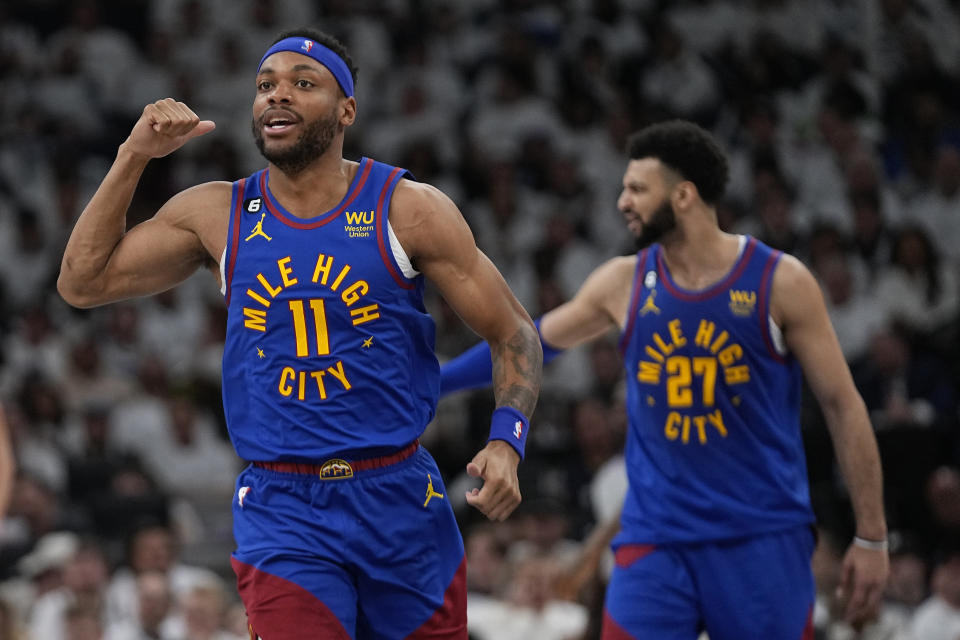 Denver Nuggets forward Bruce Brown (11) celebrates after making a basket against the Minnesota Timberwolves during the second half of Game 3 of an NBA basketball first-round playoff series Friday, April 21, 2023, in Minneapolis. (AP Photo/Abbie Parr)