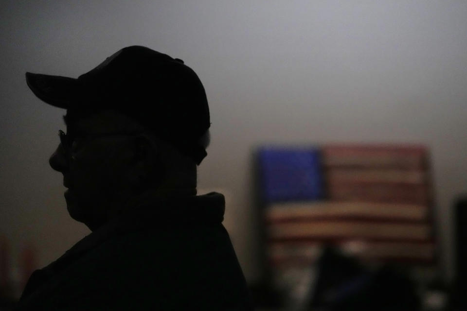 Earl Meyer, who fought for the U.S. Army in the Korean War, talks with fellow veterans at the American Legion, Tuesday, Nov. 7, 2023, in St. Peter, Minn. Meyer, 96, is suing the Army to try to get the Purple Heart medal that he says he earned when he was wounded during fierce combat in June of 1951. (AP Photo/Abbie Parr)