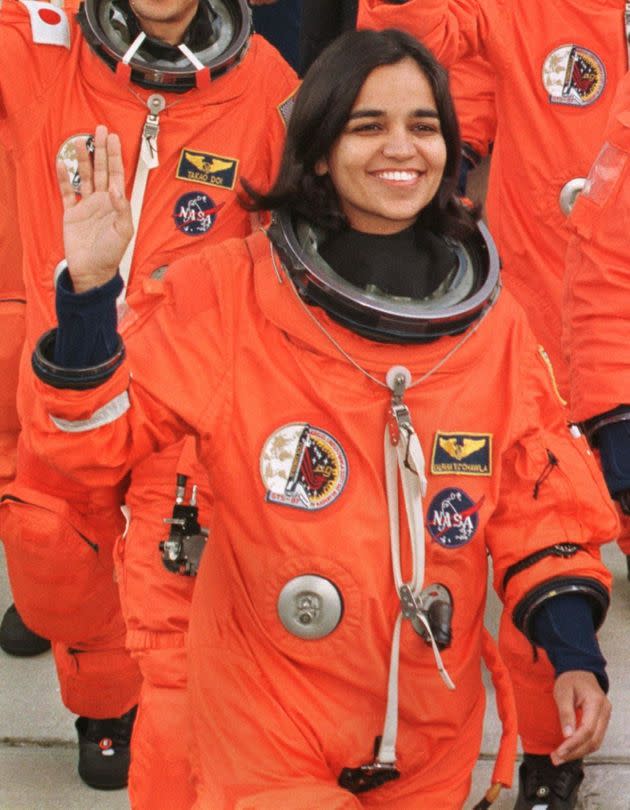 Kalpana Chawla waves to well-wishers as she leaves the Kennedy Space Center's crew quarters to board the shuttle Columbia for launch. (Photo: TONY RANZE via Getty Images)