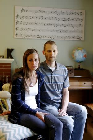 Emily and Matt Knudsen sit in their living room in their home in Fremont, California, May 14, 2015. REUTERS/Beck Diefenbach