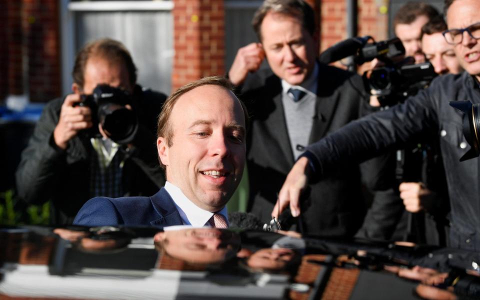 Matt Hancock enters a car after leaving his house - Toby Melville/Reuters