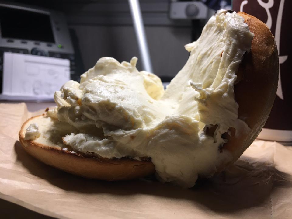 A man shared the photos of his breakfast sandwich when he asked for extra cream cheese. Source: Twitter/BryanPassifiume   