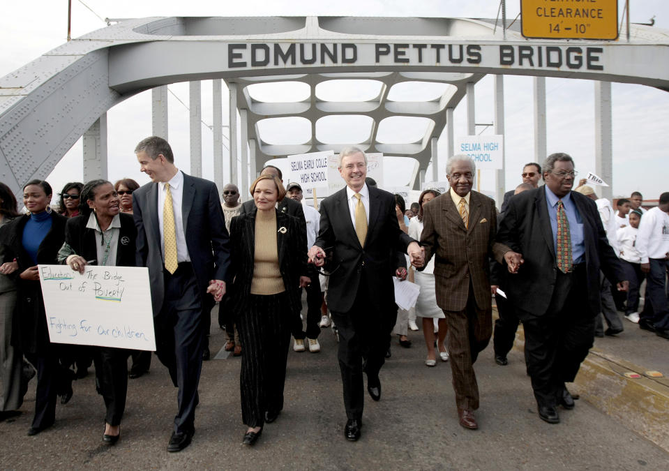 Rev. F.D. Reese, second from right, marches with a large group of students and civil rights activists over the Edmund Pettus Bridge in Selma, Ala., March 8, 2010. (Jamie Martin / AP file)