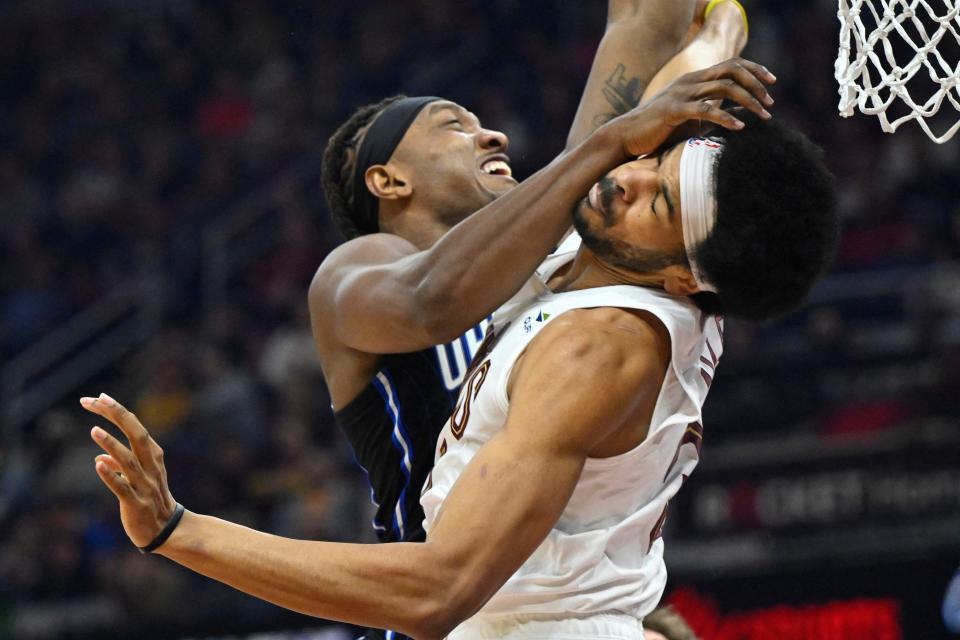 Orlando Magic center Wendell Carter Jr. collides with Cavaliers center Jarrett Allen in the second quarter, Feb. 22, 2024, in Cleveland.