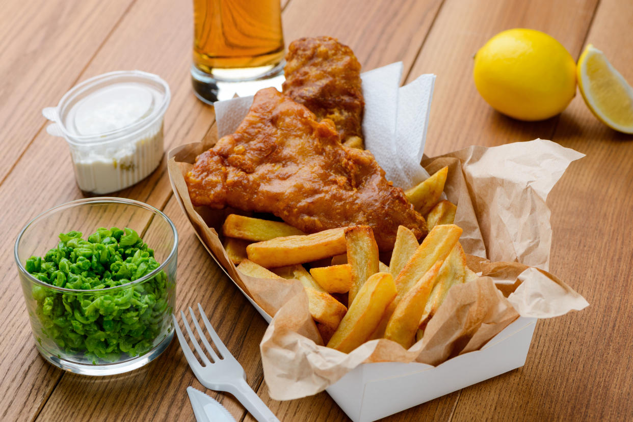 Green peas, fish and fries. Tasty and nutritious lunch in fast food restaurant. Traditional English food.