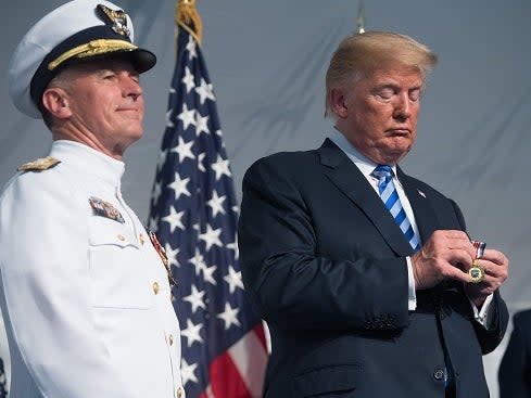 President Donald Trump looks on next to Admiral Paul Zukunft (L) as he retires as Commandant of the US Coast Guard during a Change of Command ceremony  in 2018 (AFP via Getty Images)