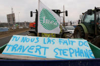 French farmers drive their tractors on the A7 highway to protest changes in underprivileged farm area’s mapping and against Mercosur talks, in Pierre-Benite near Lyon, France, February 21, 2018. Message reads "You did it wrong, Stephane" in reference to French Agriculture Minister Stephane Travert. REUTERS/Emmanuel Foudrot