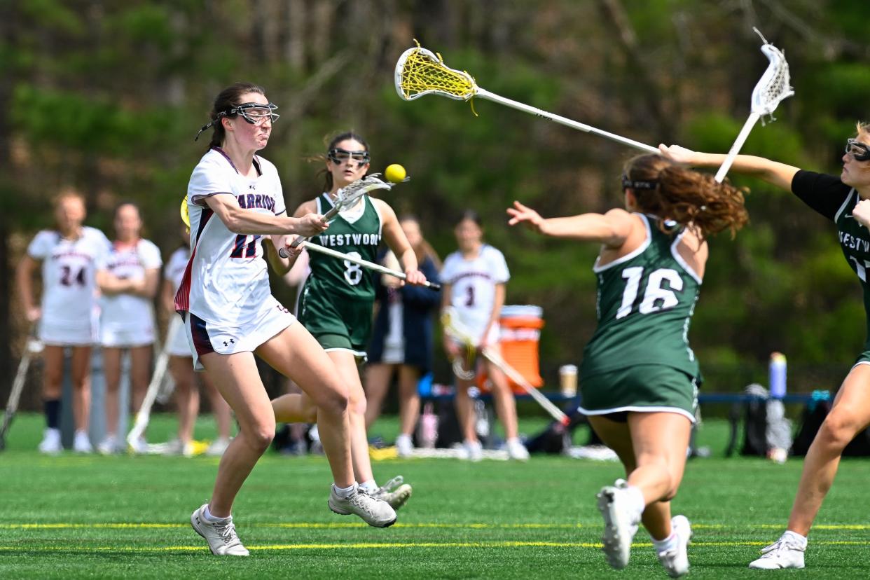 Lincoln-Sudbury senior Harper Friedholm takes a shot on goal during a girls lacrosse game versus Westwood at Lincoln-Sudbury High School, Friday, April 19, 2024.