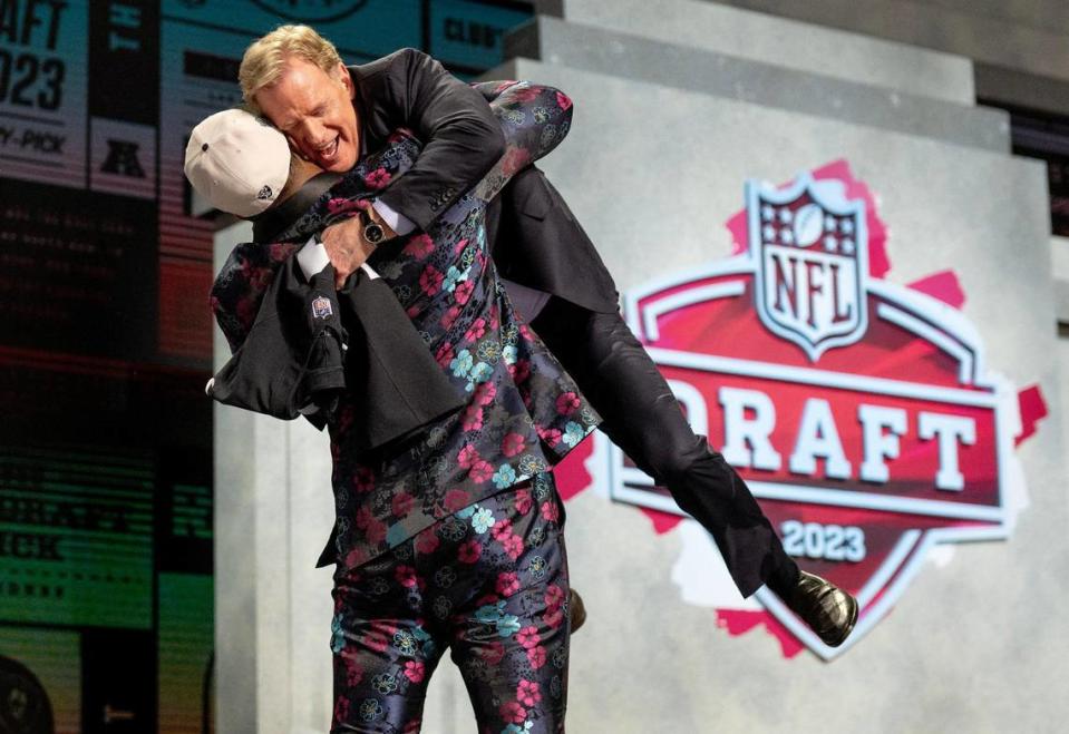 Texas Tech edge Tyree Wilson picks up NFL Commissioner Roger Goodell after being picked seventh overall by the Las Vegas Raiders during the NFL Draft outside of Union Station on Thursday, April 27, 2023, in Kansas City.