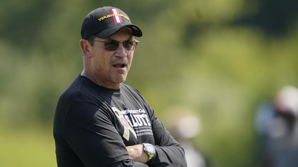 Washington Football Team head coach Ron Rivera looks over the field during practice at the team's NFL football training facility in Ashburn, Va., Wednesday, Aug. 25, 2021. (AP Photo/Carolyn Kaster)