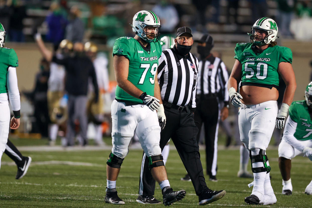 Marshall offensive lineman Josh Ball (79) is escorted to the sideline by an official after being ejected during the fourth quarter of the 2020 Conference USA championship game. (Photo by Frank Jansky/Icon Sportswire via Getty Images)