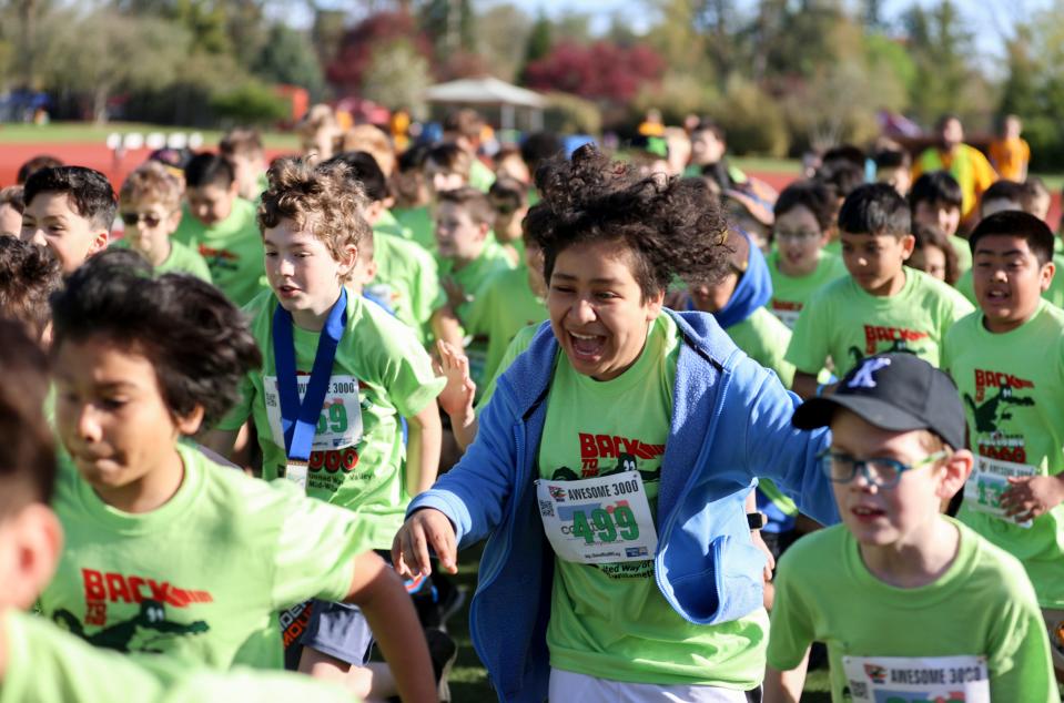 Fifth-grade boys start their race during the Awesome 3000 fun run.