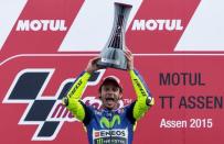 Yamaha MotoGP rider Valentino Rossi of Italy celebrates on the podium after winning the MotoGP race at the TT Assen Grand Prix at Assen, the Netherlands June 27, 2015. REUTERS/Michael Kooren