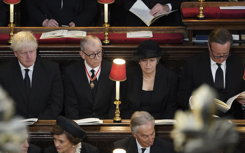 From left, former British Prime Ministers Boris Johnson, Philip May, Theresa May and David Cameron attend the state funeral of Queen Elizabeth II, held at Westminster Abbey.