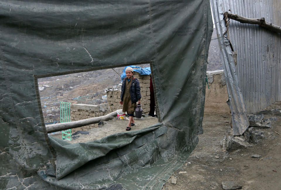 <p>A boy fetches water to his home, on the outskirts of Kabul, Afghanistan, Feb. 28, 2017. (AP Photo/Rahmat Gul) </p>