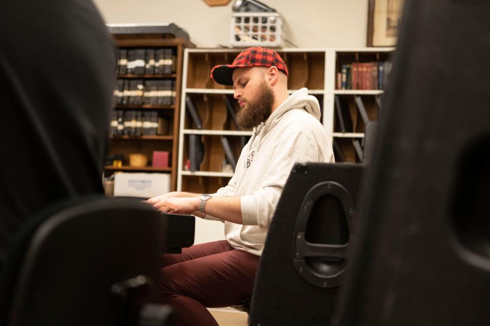 Keyboardist Aris Chalin rehearses with Minor Element at First Congregational Church in Battle Creek on Tuesday, March 28, 2023.