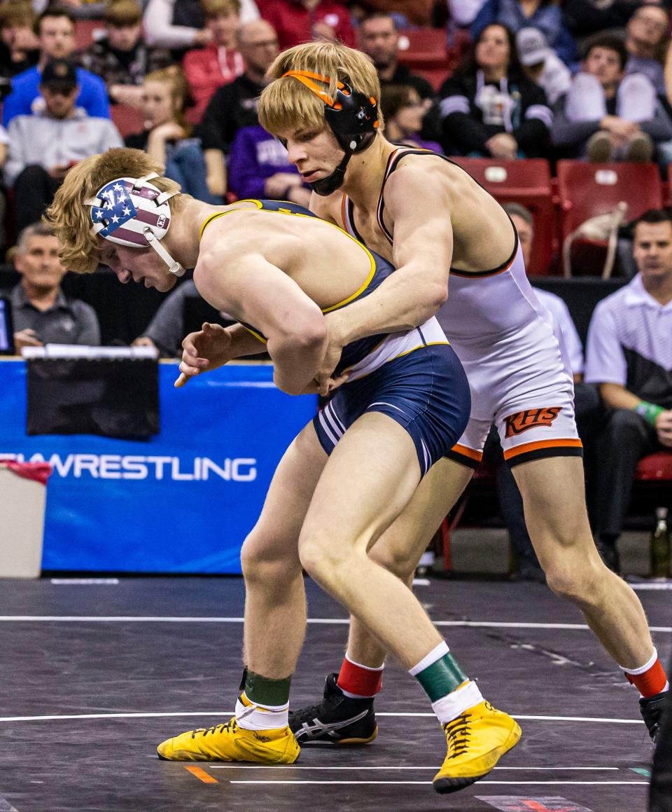 Kaukauna's Greyson Clark, right, is undefeated this season and going for his fourth consecutive state championship.