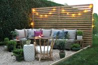 <p>Create a comfy backyard living space with a plush sofa and pillows, tons of potted plants, and a privacy fence made out of wooden pallets. String lights help change the fence from a boring backdrop to an inspiring installation.</p><p><strong>See more at </strong><strong><a href="https://cityfarmhouse.com/2017/08/new-modern-rustic-outdoor-privacy-screen-the-rest-of-my-patio.html" rel="nofollow noopener" target="_blank" data-ylk="slk:City Farmhouse;elm:context_link;itc:0;sec:content-canvas" class="link ">City Farmhouse</a></strong><strong>.</strong></p><p><a class="link " href="https://go.redirectingat.com?id=74968X1596630&url=https%3A%2F%2Fwww.homedepot.com%2Fs%2Fprivacy%252520fence%252520panels&sref=https%3A%2F%2Fwww.countryliving.com%2Fgardening%2Fnews%2Fg3404%2Fbackyard-string-lights%2F" rel="nofollow noopener" target="_blank" data-ylk="slk:SHOP PRIVACY FENCES;elm:context_link;itc:0;sec:content-canvas">SHOP PRIVACY FENCES</a></p>