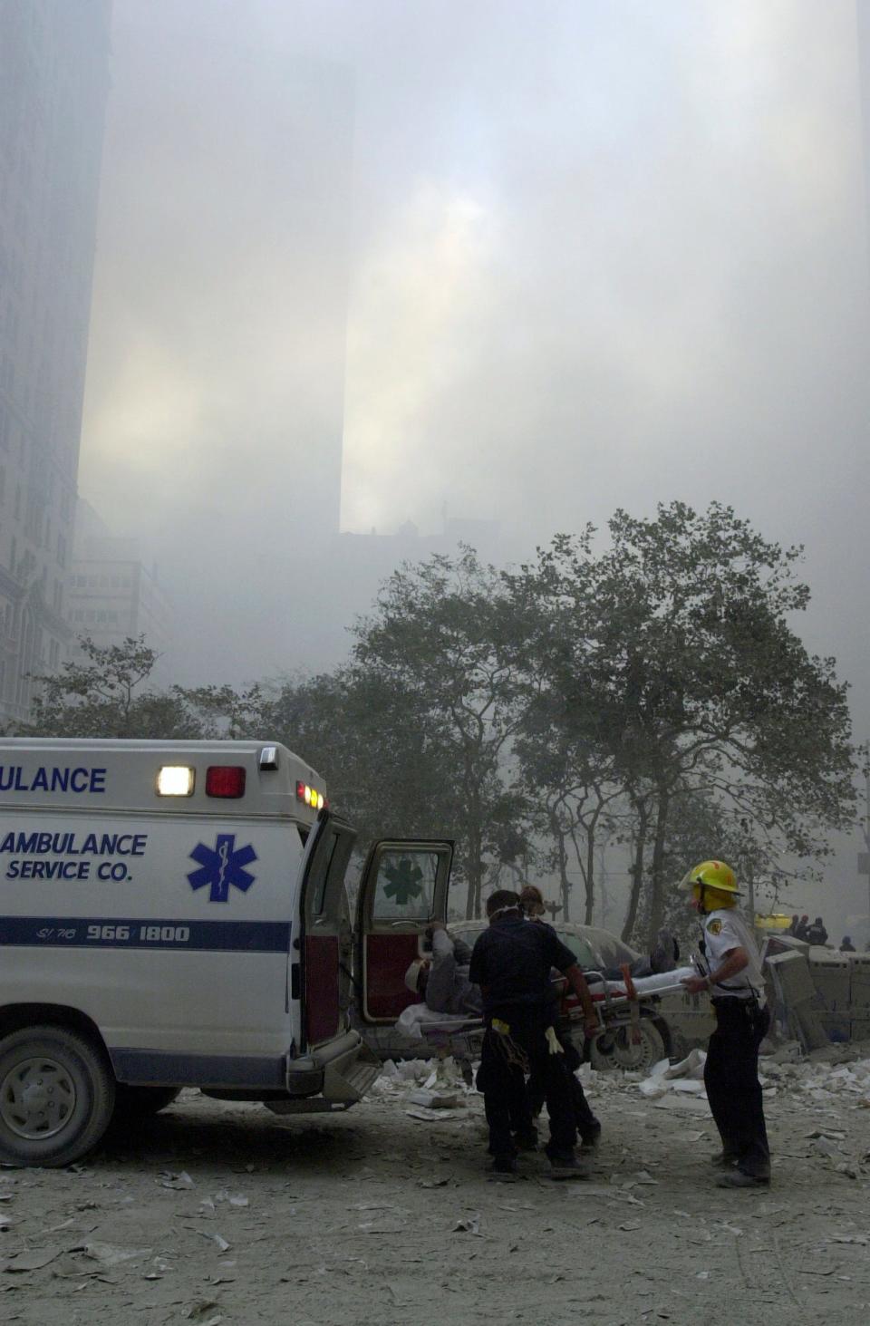 A man is lifted by stretcher into an ambulance after the collapse of both World Trade Center towers.