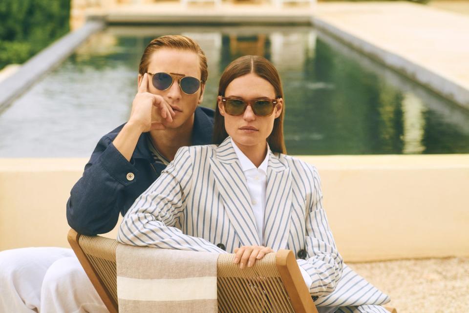 a man and woman sitting on a bench