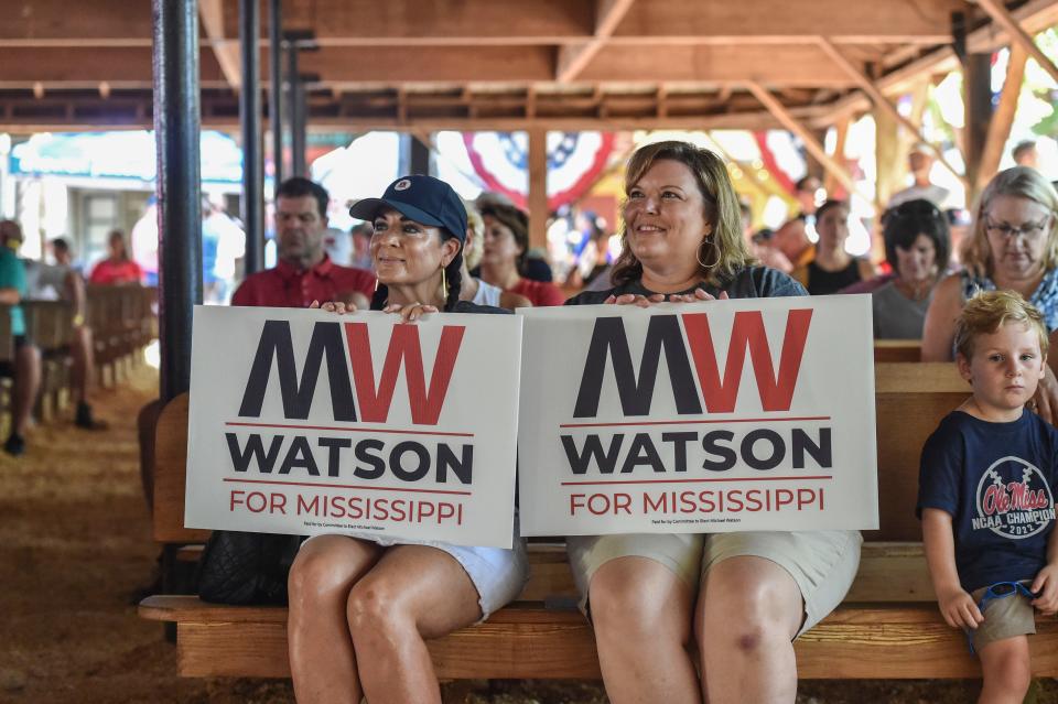 Supporters of Secretary of State Michael Watson watch him speak at the Neshoba County Fair in Philadelphia, Miss., Thursday, July 28, 2022.