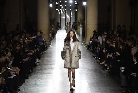 Models display creations during the Topshop Unique Autumn/Winter 2015 collection show at London Fashion Week in London February 22, 2015. REUTERS/Toby Melville