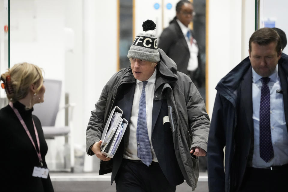 Britain's former Prime Minister Boris Johnson leaves after the COVID Inquiry at Dorland House in London, Thursday, Dec. 7, 2023. Johnson rejected suggestions that he wanted to let COVID-19 "rip" through the population as he defended his handling of the pandemic during a second day of testimony at a public inquiry into the crisis. (AP Photo/Kirsty Wigglesworth)