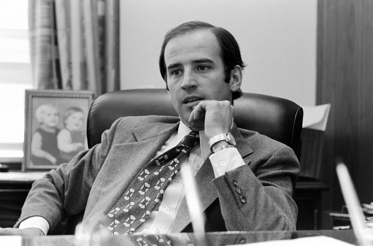 Joe Biden at his desk (Guy DeLort / WWD/Penske Media via Getty Images)