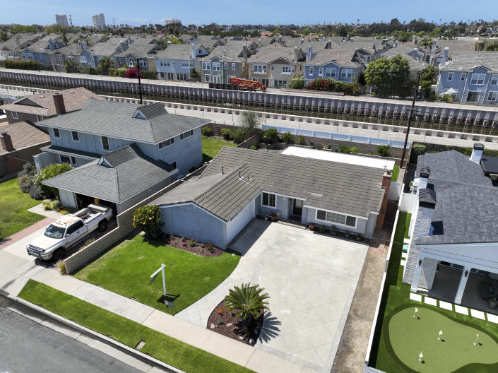 Huntington Beach, CA - April 22: A view of a home for sale at center of photo, 20821 Catamaran Ln. in Huntington Beach, listed at $1,199,000 Friday, April 22, 2022. The median home price in Orange Count has reached $1 million for the first time in history. (Allen J. Schaben / Los Angeles Times via Getty Images)