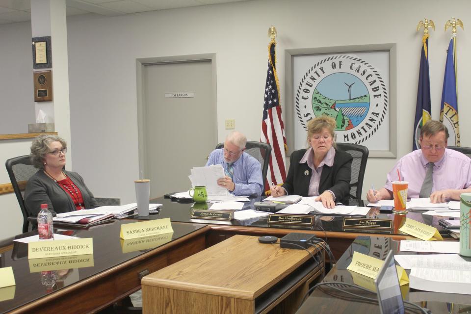 Cascade County elections officials sort thorough precinct results from the Nov. 7. municipal elections. From left to right are Election Administrator Sandra Merchant, and County Commissioners Jim Larson, Rae Grulkowski and Joe Briggs. The final certification is now in violation of a state imposed deadline