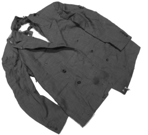 A tattered dark gray suit jacket is laid on a white background.