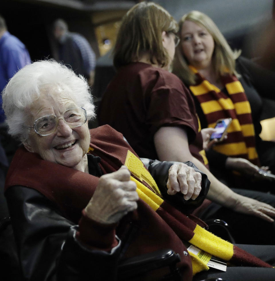 Sister Jean Dolores Schmidt sits with other Loyola-Chicago fans during the first half of a regional semifinal NCAA college basketball game against Nevada, Thursday, March 22, 2018, in Atlanta. (AP Photo/David Goldman)