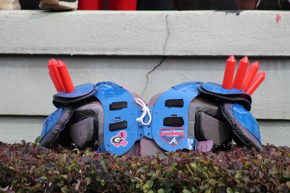 Members of the UGA student section made a special set of spiked shoulder pads for Braves mascot Blooper to wear during the Bulldogs' game against Missouri.