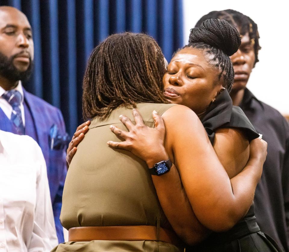 Pamela Dias, right, is hugged by a close friend during the press conference Wednesday. About 100 people gathered for a press conference with Civil Rights Attorney Ben Crump Wednesday afternoon, June 7, 2023 at the New St. John Missionary Baptist Church in Ocala, FL. An arrest was made late Tuesday, early Wednesday morning in the fatal shooting of Ajike "AJ" Shantrell Owens. Crump represents the family. Owens was shot while standing outside her neighbor's door the night of June 2 in Quail Run, located off County Road 475A in Ocala. Quail Run consist of single story duplex and quadraplex. Susan Louise Lorincz, 58, now faces charges of manslaughter with a firearm, culpable negligence, two counts of assault and battery. [Doug Engle/Ocala Star Banner]2023