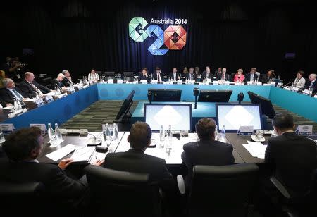 Australian Prime Minister Tony Abbott (Rear, C) addresses the B20 meeting before the G20 leaders summit in Brisbane, November 14, 2014. REUTERS/Jason Reed