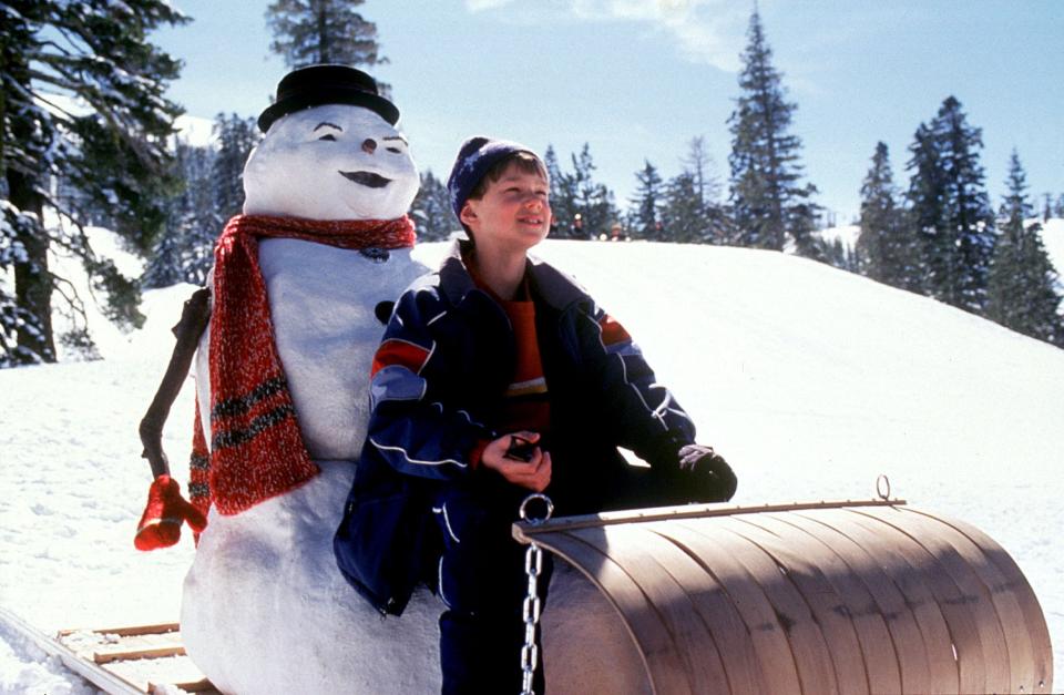 Charlie Frost (Joseph Cross) goes sledding with the snowman form of his dead dad (Michael Keaton) in "Jack Frost."