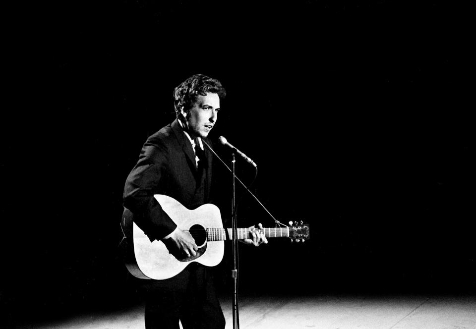 Guest star Bob Dylan, center, sings "I Threw It All Away" during a taping for the first episode of "The Johnny Cash Show" at the Ryman Auditorium on May 1, 1969.