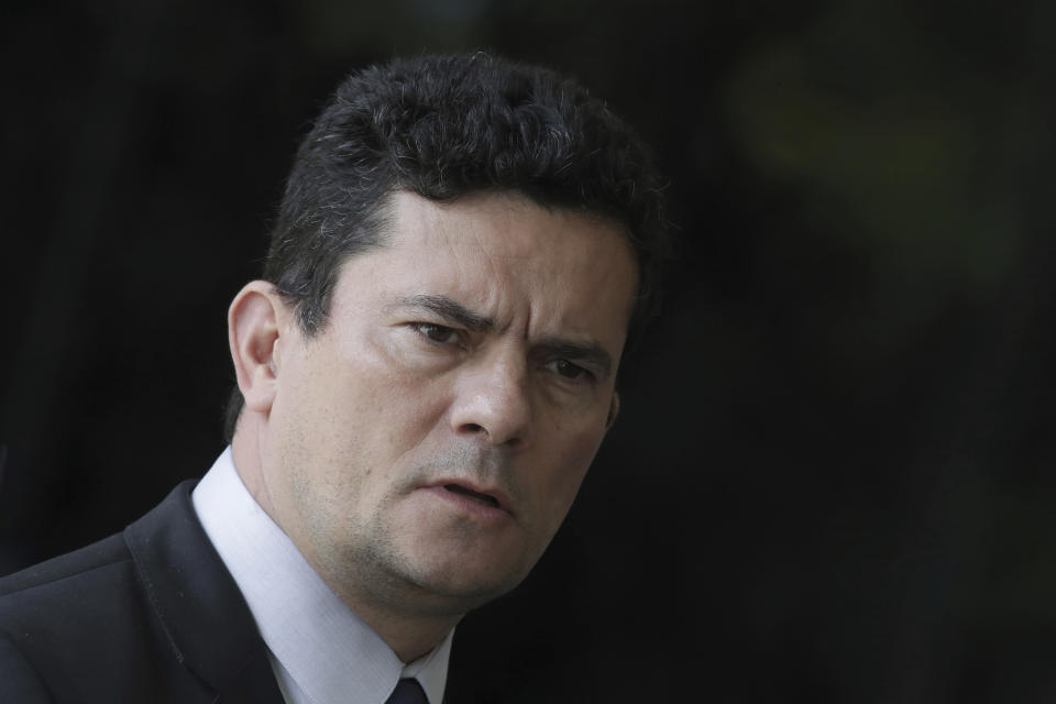 FILE - In this Dec. 4, 2018 file photo, Justice Minister Sergio Moro, who was appointed Justice Minister by President-elect Jair Bolsonaro, speaks to the press as he arrives to Bolsonaro's team transition office in Brasilia, Brazil. Bolsonaro said on Sunday, May 12, 2019 that he will nominate the anti-corruption crusader to the Supreme Court whenever there is an opening. (AP Photo/Eraldo Peres, File)