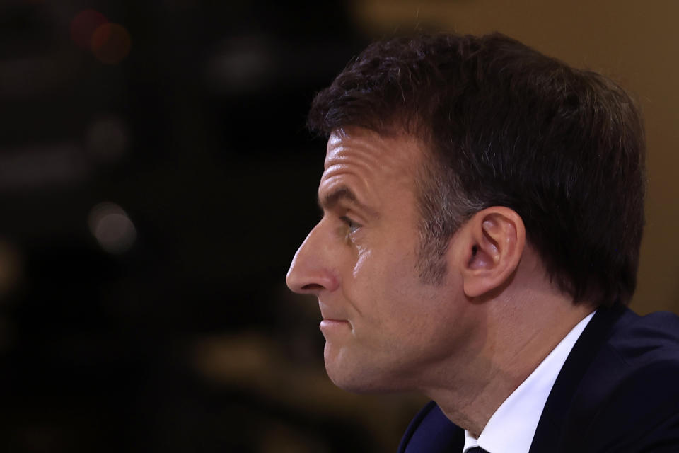 French President Emmanuel Macron listens to a question during his first prime-time news conference to announce his top priorities for the year as he seeks to revitalize his presidency, vowing to focus on "results" despite not having a majority in parliament, Tuesday, Jan. 16, 2024 at the Elysee Palace in Paris. (AP Photo/Aurelien Morissard)