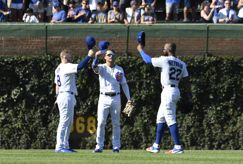 Chicago Cubs left fielder Ian Happ (8) center fielder Albert Almora Jr, center, and right fielder Jason Heyward (22) celebrate their 6-2 win against the Milwaukee Brewers in a baseball game, Friday, Aug. 2, 2019, in Chicago. (AP Photo/David Banks)
