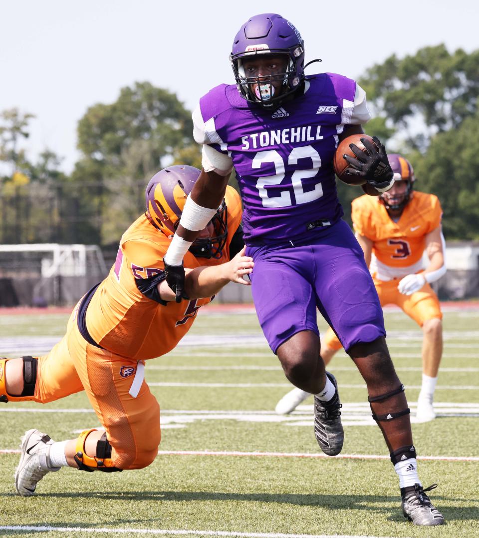 Stonehill's Marje Mulumba intercepts the pass during a game versus Post University on Saturday, Sept. 10, 2022. 